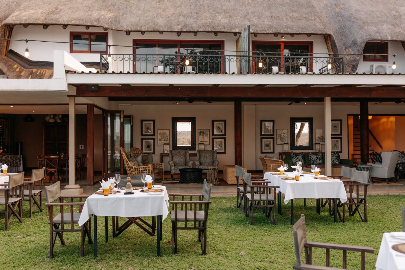 Buhala Lodge thatched main building and courtyard dining area in Kruger