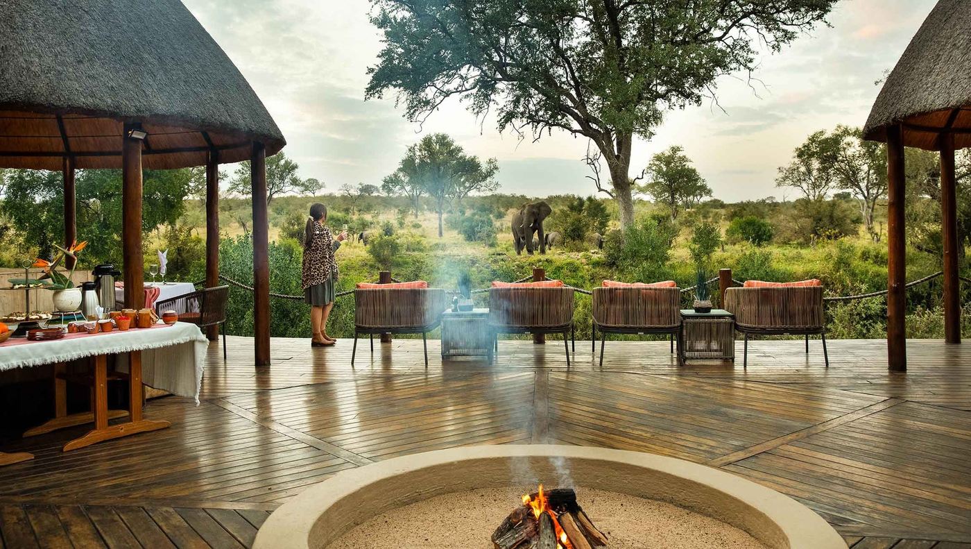 Fire pit deck overlooking the bush at dawn at Hoyo Hoyo Safari Lodge