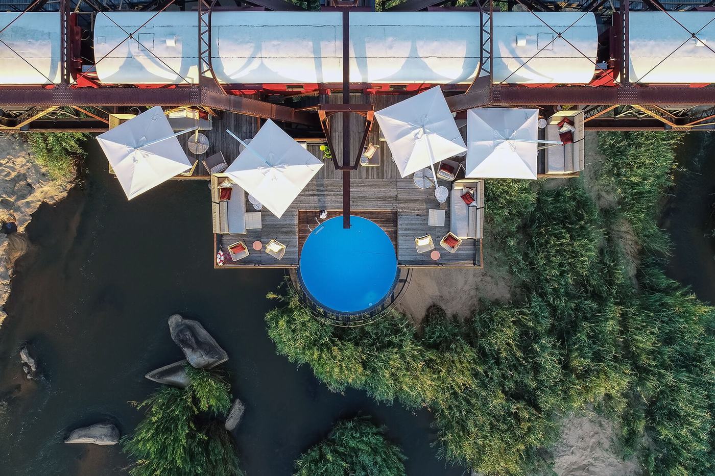Overhead view of the bridge deck lounge and plunge pool at Kruger Shalati