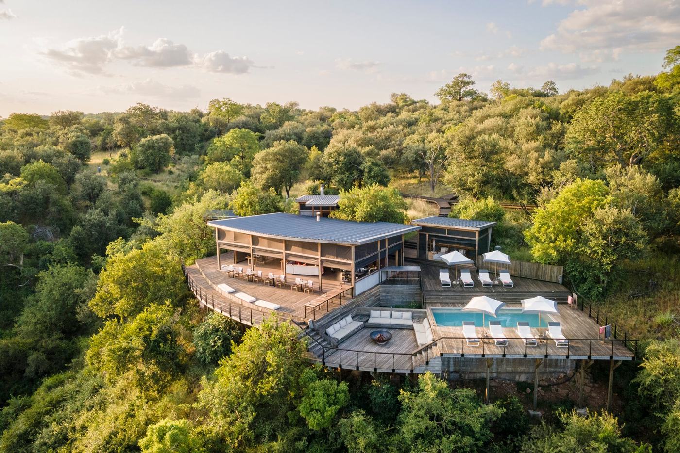 Pel's Post aerial view of the lodge deck and pool above the bush in Kruger