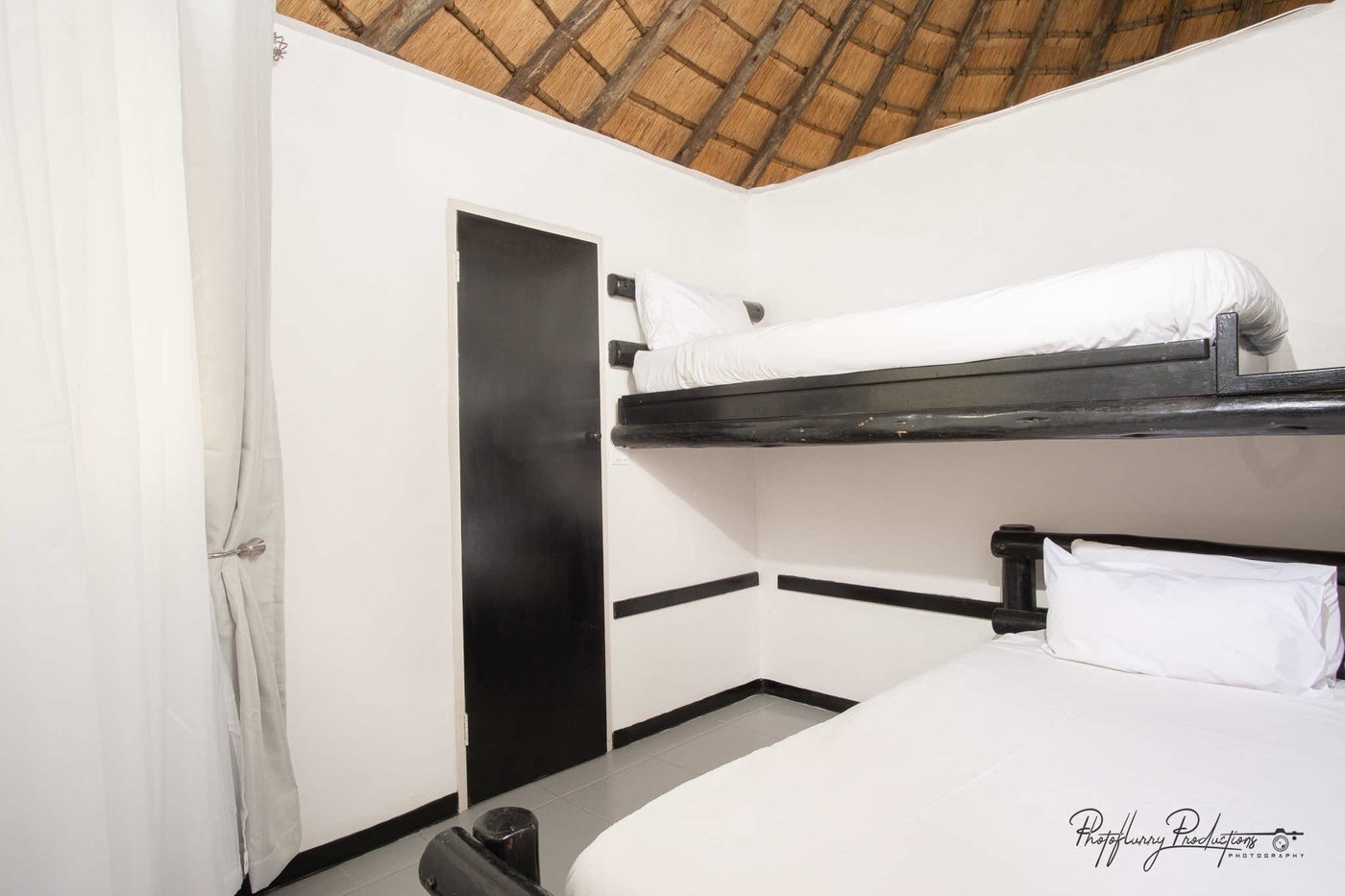 Twin bunk beds in a family room at Sefapane Lodge